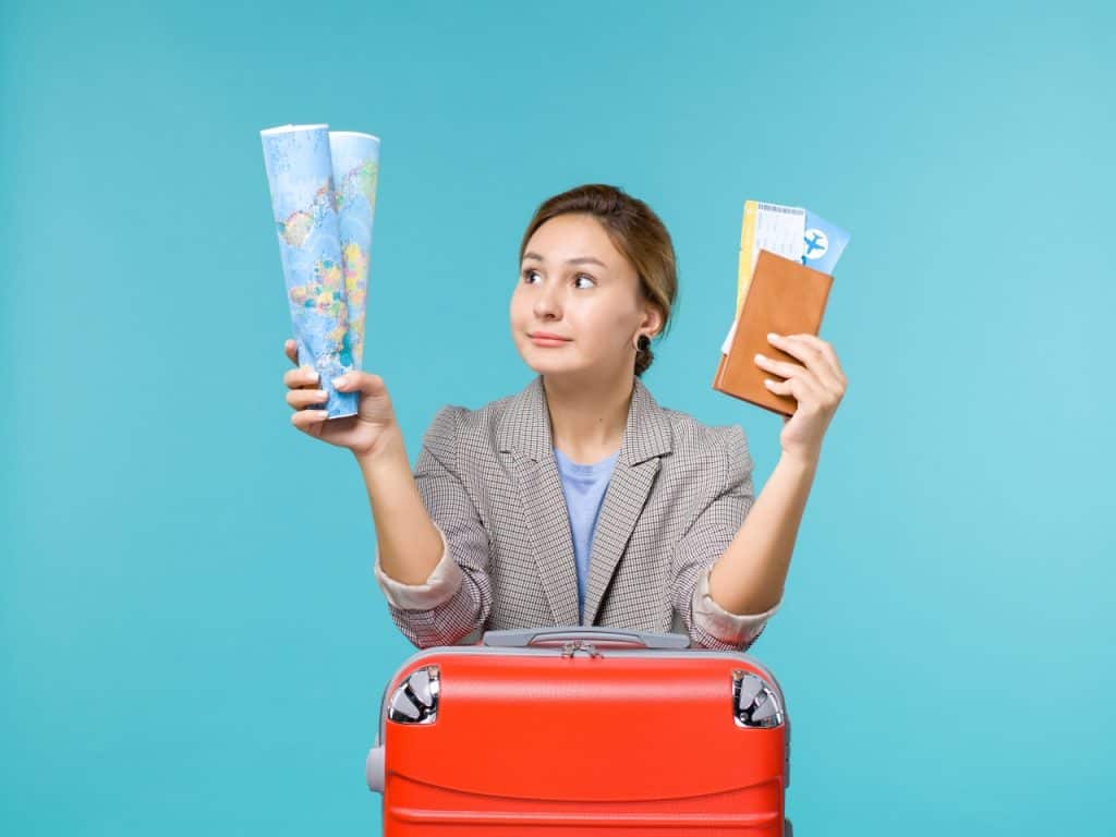 front-view-female-vacation-holding-map-wallet-tickets